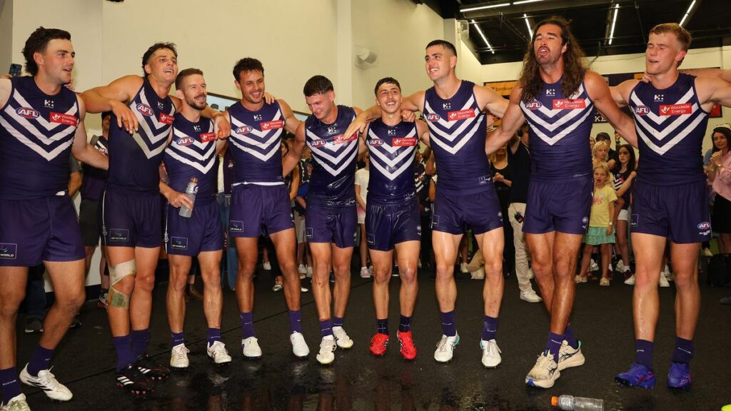 Fremantle Dockers club song: The big change to the way Freo players sing after a win