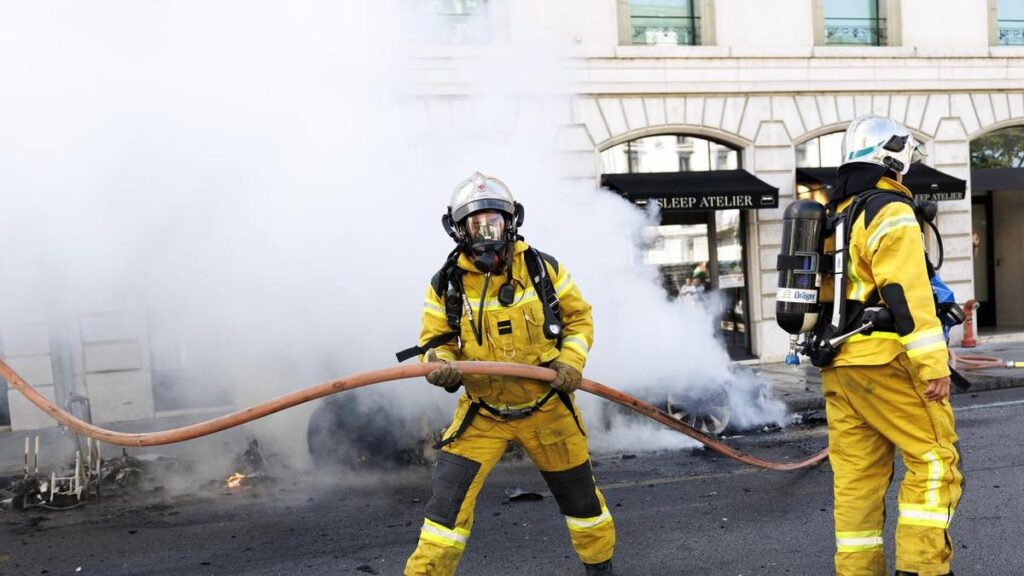 Protesters smash windows, set Tesla ablaze in G7 march