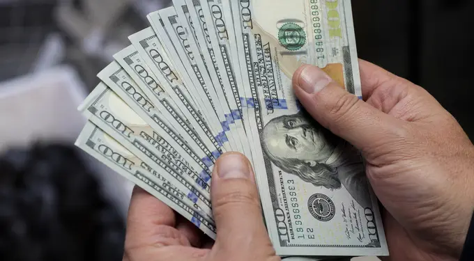 US dollar slips from recent highs as market focus shifts to inflation data