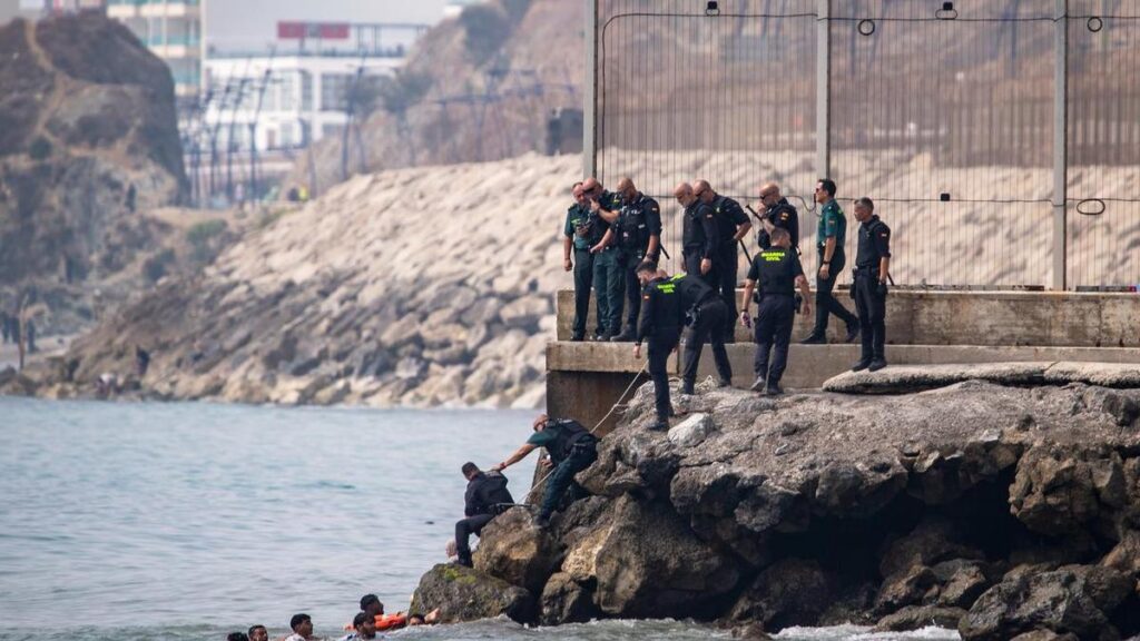 Migrants at Spanish territory's border overwhelm police