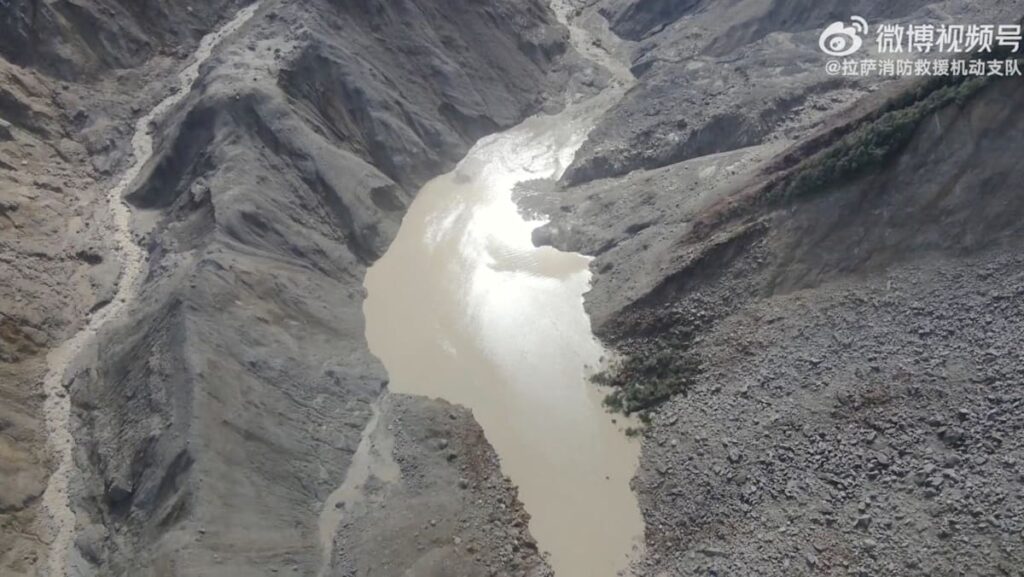 Lake overflows on Nepal-China border, sparking panic and halting rescue