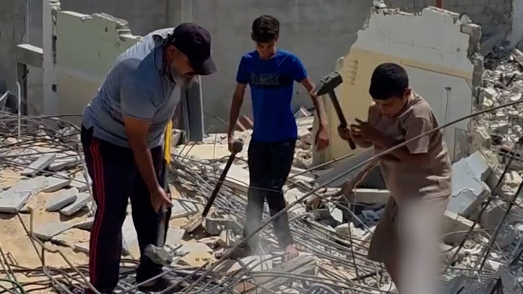 Father and sons forced to manually clear rubble in Gaza | Israel-Palestine conflict News