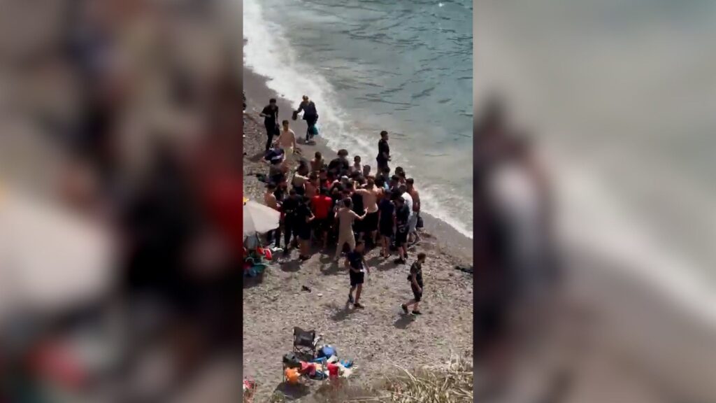 Dozens of migrants land on Spanish coast surprising beachgoers | Politics