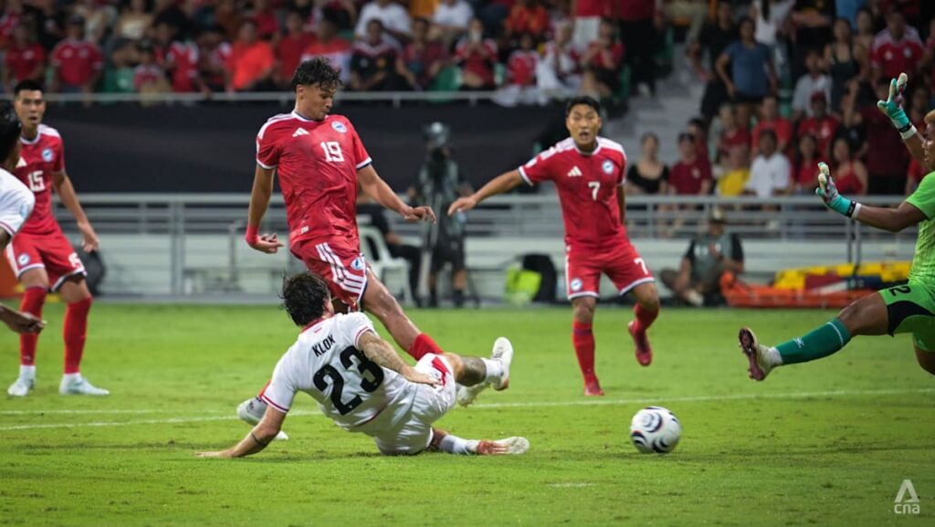 Singapore advance to ASEAN football championship semi-finals after draw with Indonesia