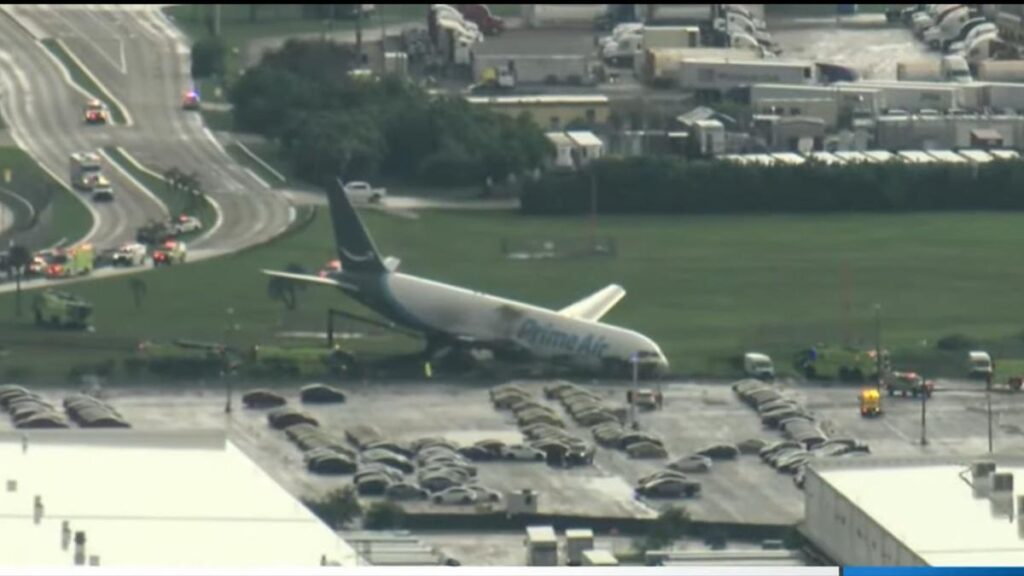 Miami International Airport shut down after Amazon cargo plane crashes off runway and catches fire