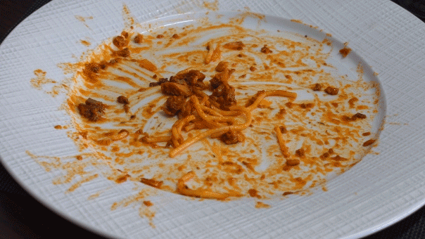 Restaurant etiquette says wait for all diners before clearing plates