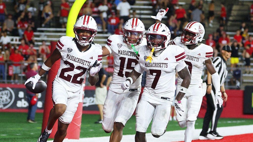 UMass player absolutely obliterates unsuspecting woman on the sidelines after interception