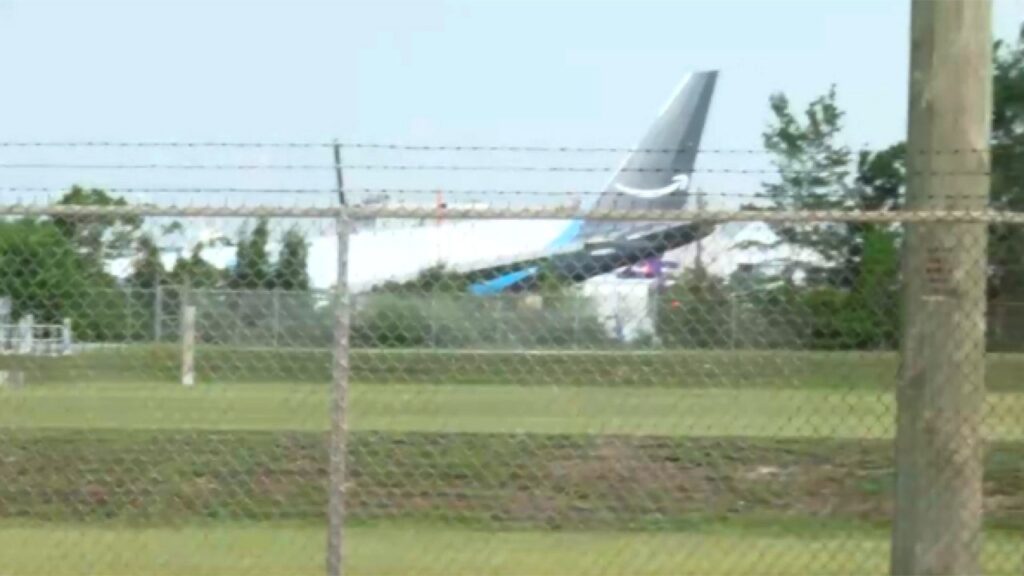 Amazon cargo jet overruns runway at Miami airport, striking multiple vehicles