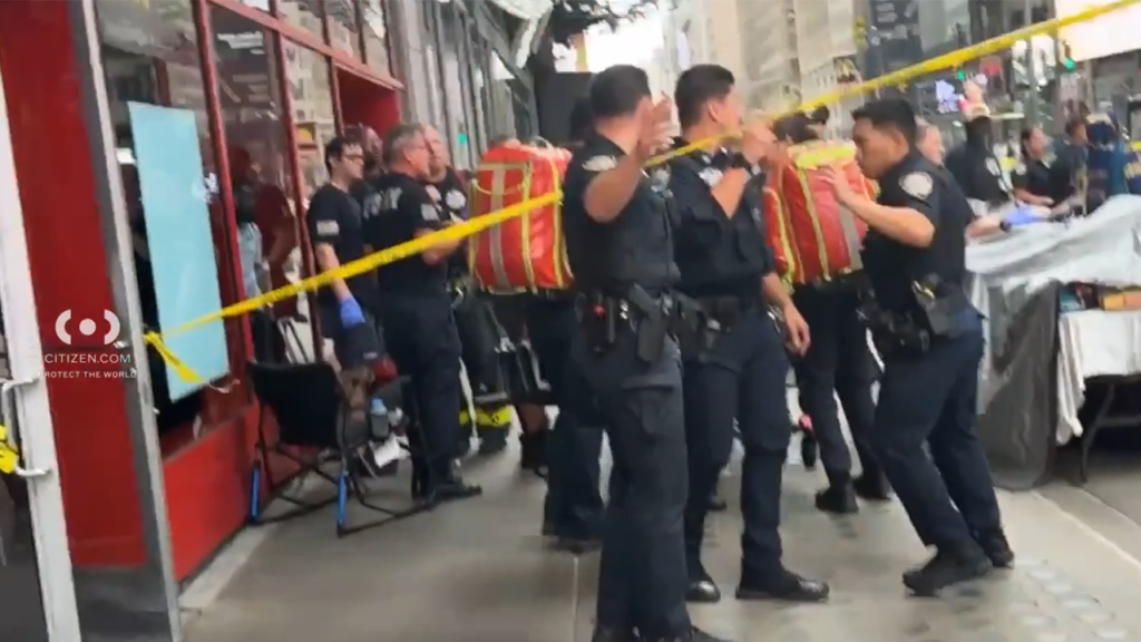 Knife-wielding woman accused of stabbing 2 in Times Square shot by police