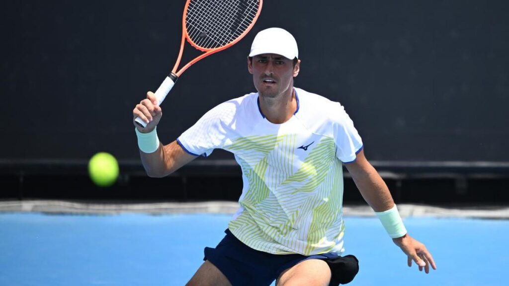 Tomic tumbles out as Italian proves his master in China